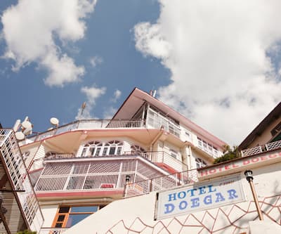 https://imgcld.yatra.com/ytimages/image/upload/t_hotel_yatra_city_desktop/v1391019571/Domestic Hotels/Hotels_Shimla/Hotel Doegar/Facade2~2.jpg